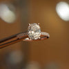 front image luxury oval rose gold diamond set shoulders hidden halo lab grown diamond engagement ring