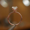 side image in studio of luxury oval rose gold diamond set shoulders hidden halo lab grown diamond engagement ring