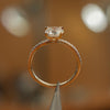 side angle of luxury round yellow gold diamond set shoulders lab grown diamond engagement ring