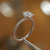 side shot of round white gold diamond set shoulders lab grown diamond engagement ring