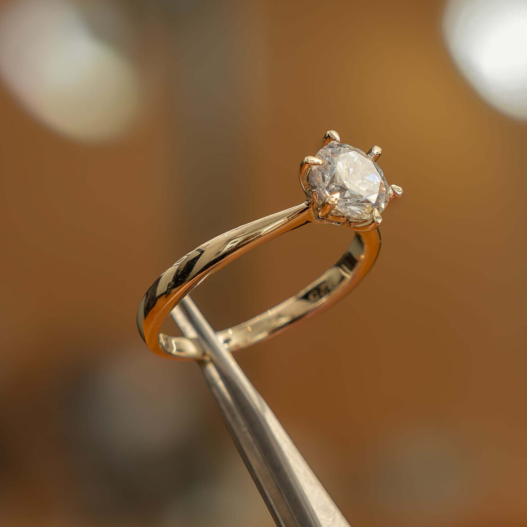 left side of luxury round yellow gold solitaire lab grown diamond engagement ring